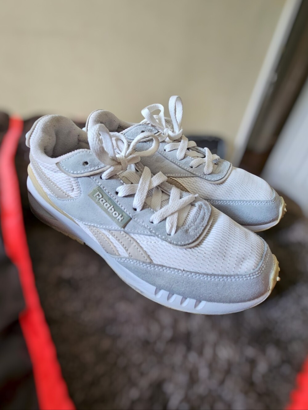 Reebok Classic Legacy sneakers feature a white mesh upper with gray suede overla